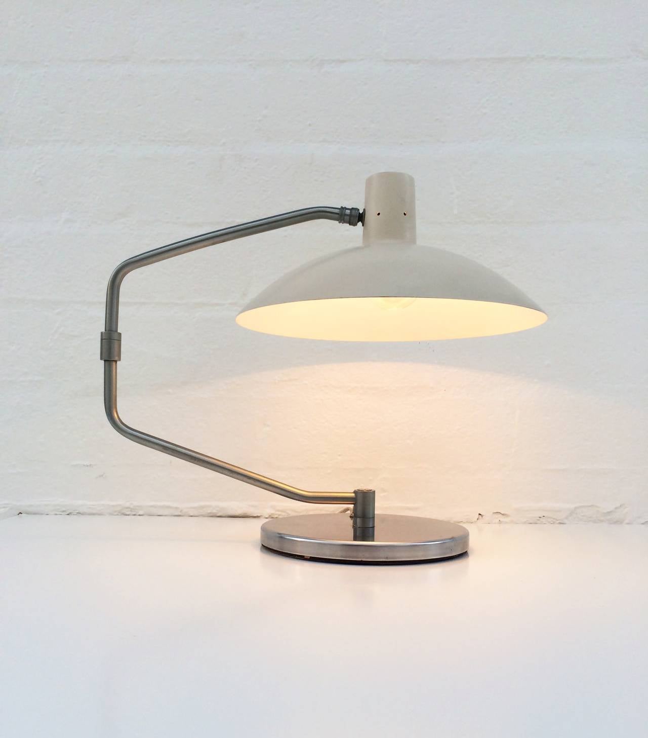The No.4 desk lamp designed by Clay Michie for Knoll International. 
Consist of a off white enameled shade, a brushed aluminum adjustable arm and base. 
Newly rewired.