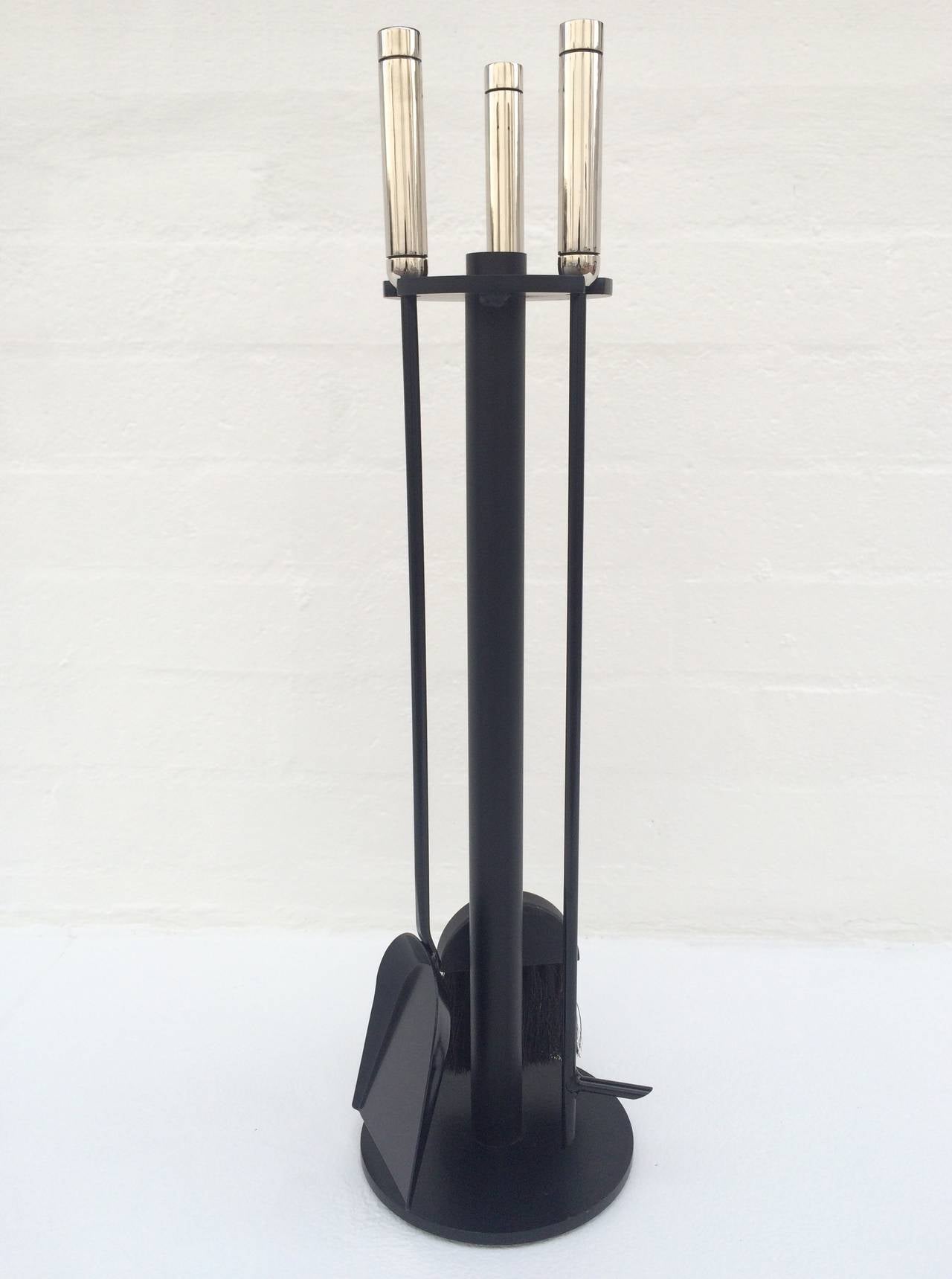 For your consideration a set of fireplace tools. The handles are nickeld plated and the rest is black enameled metal.