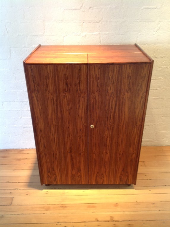A danish rosewood desk that can be closed into a cube.
This desk comes with two keys.
A perfect desk for a small space,or New York loft.
When closed it's 32