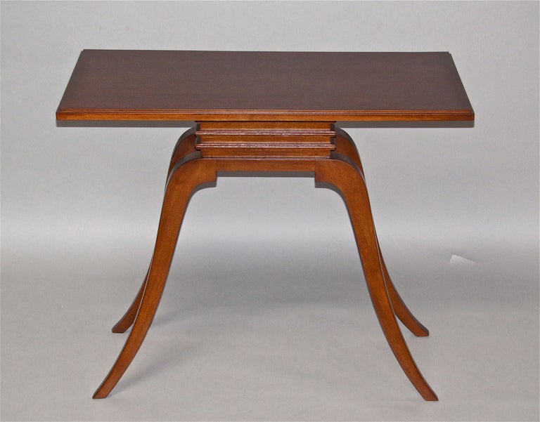 Paul Frankl mahogany console designed for Brown-Saltman of California. Based on an Asian design and is a mirror image on front and back. Solid bleached mahogany has more recently been refinished.

Measures: 36