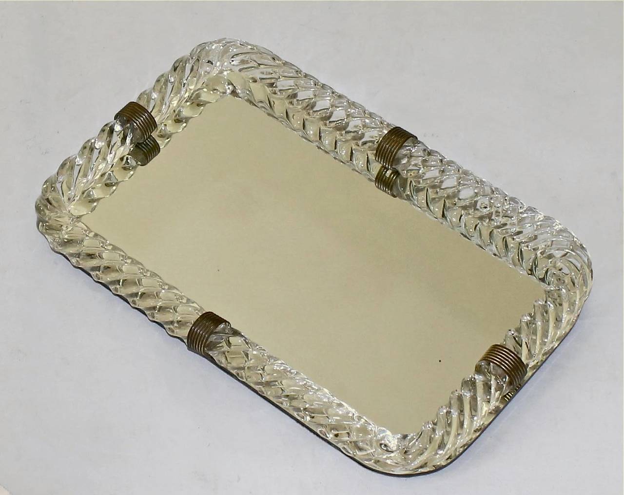 Mirrored Murano Venini style glass vanity tray surmounted by thick twisted blown glass with decorative brass straps.