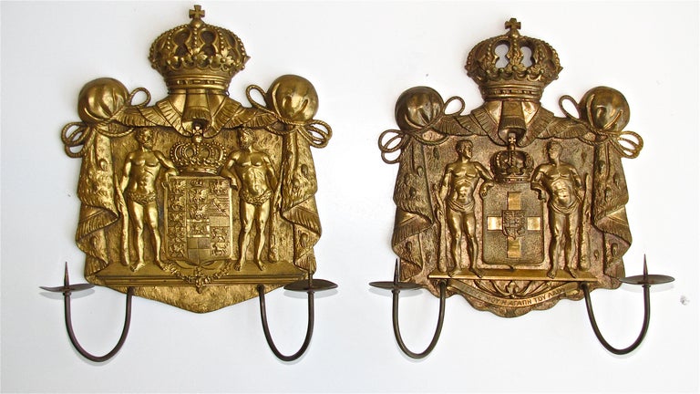Pair of finely detailed gilt bronze neoclassic motif two-arm candle wall sconces.
