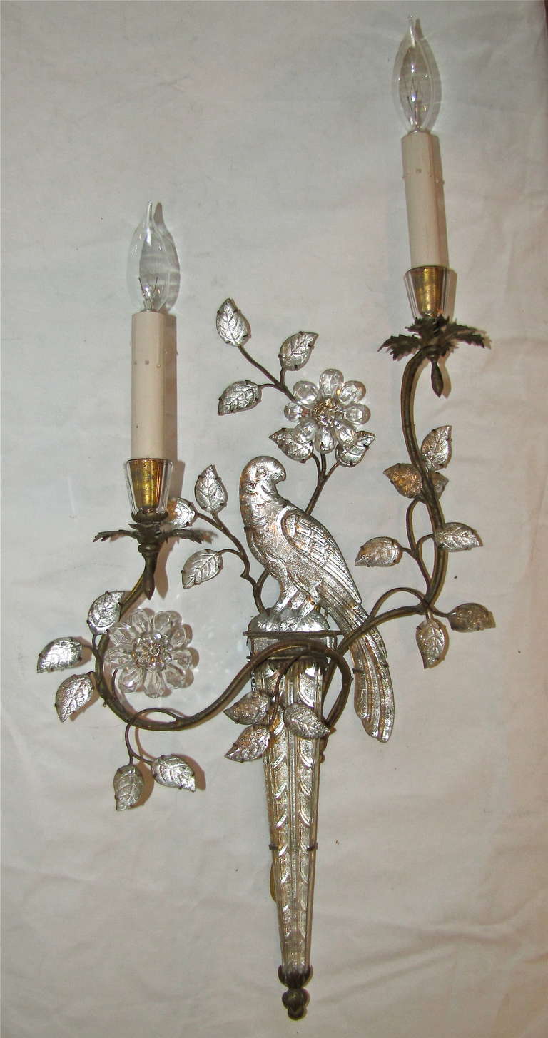 Stunning French 1940's two light wall sconce by Maison Bagues with crystal parrot motif mounted on gilt metal frame. Rewired with French style rayon covered cord. Uses 2 - 40 watt candelabra sbase bulbs.
