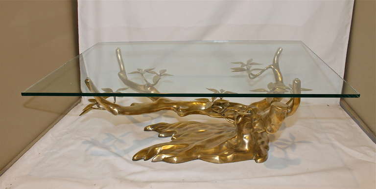 Beautiful organic tree form bronze/brass cocktail table attributed to Willy Daro. Glass top is included with this item. Size of table base: 40