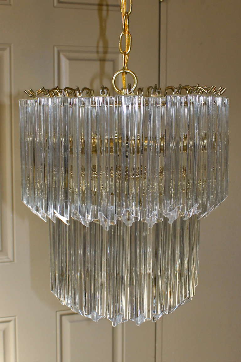 Venini two tier round chandelier with triedi crystals. Brass finish frame with 6 - 40 watt max candelabra base bulbs. Rewired. Total height with chain and canopy 33