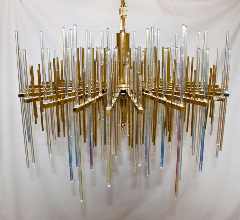 Stunning rare Sciolari 12 light brass chandelier with clear and irridescent colored glass rods. The chandelier is exquisitely crafted and the glass rods create an aurora borealis effect.  Uses 12 - 40 watt max candelabra base bulbs. Newly wired.