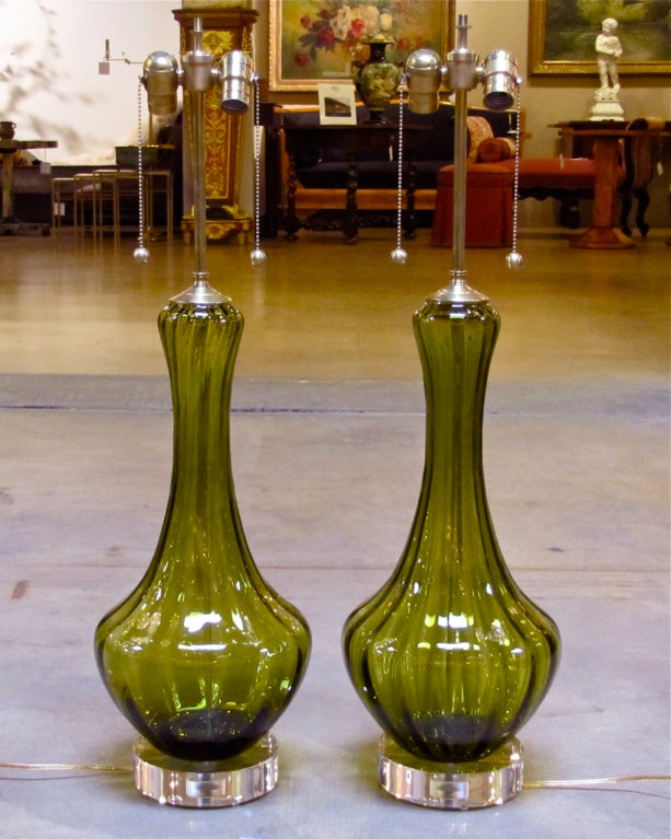 Pair of absinthe green colored Murano glass lamps on custom acrylic bases with brushed brass fittings.