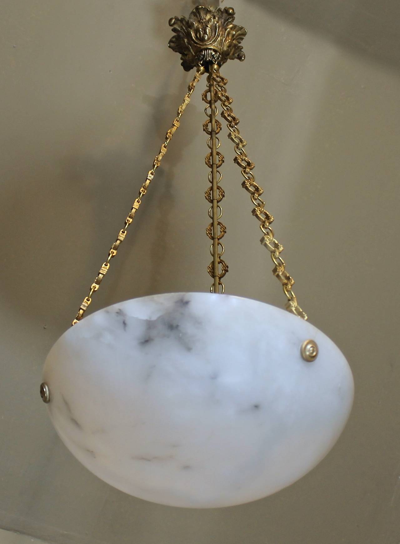 French alabaster pendant light fixture with nicely detailed brass fittings and subtle veining. Newly wired. Uses 1 - 60 watt max 