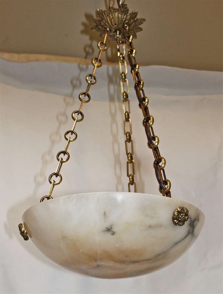 French 1930s alabaster pendant light with attractive brass fittings and ceiling cap. Uses 1 - 60 watt max 