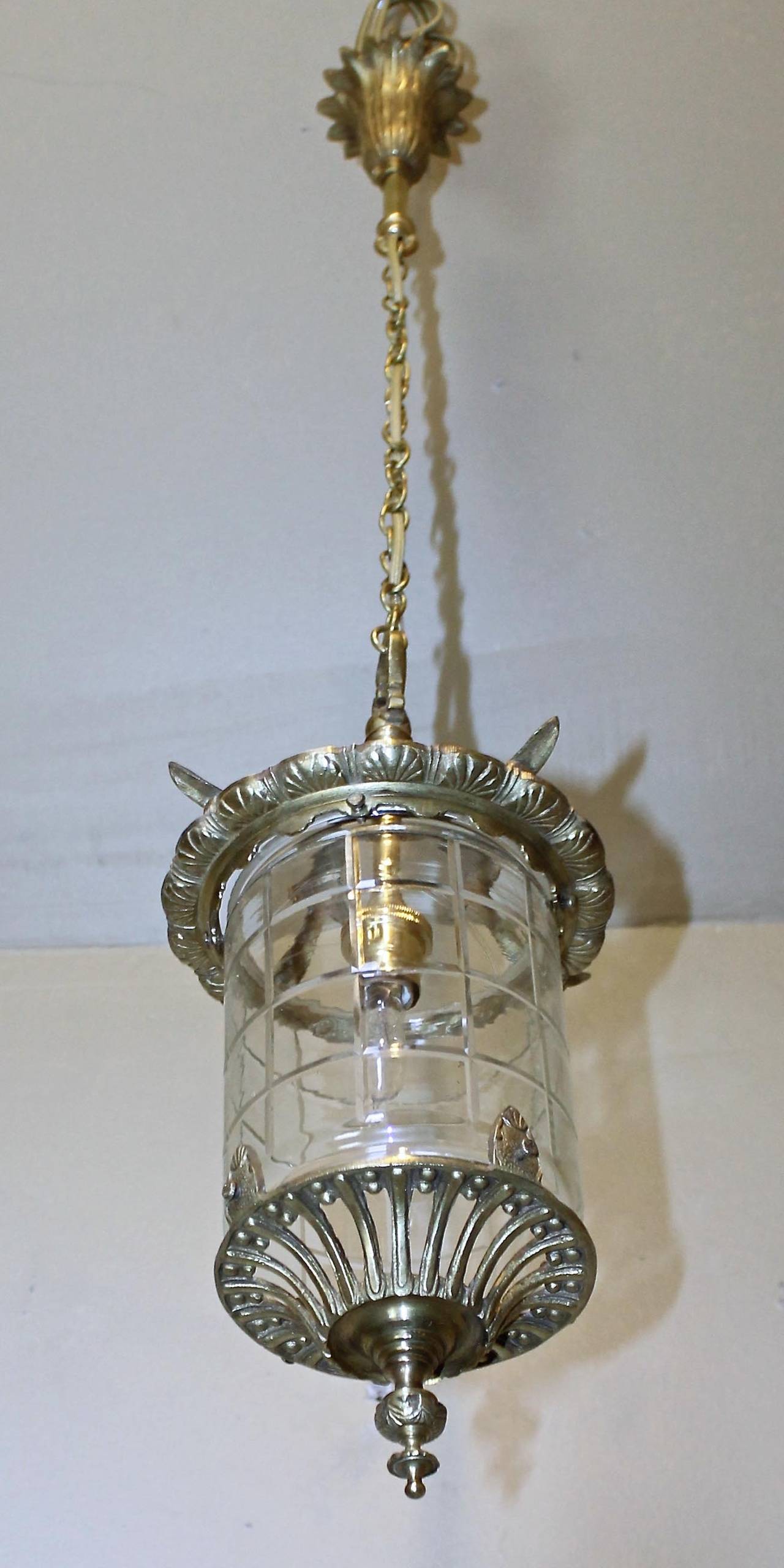 French brass handing lantern with single 40-watt candalabra size bulb inside a fitted glass dome. Very nice overall detailing to brass. Perfect for smaller hall, entry or powder bath. Overall height with chain and ceiling cap is 31
