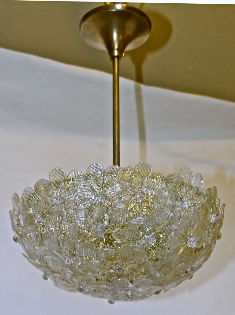 Barovier floral ceiling pendant light with brass hardware and ceiling cap. Composed of two types of blown glass flowers in clear and clear with gold inclusions. Fixture alone is 11