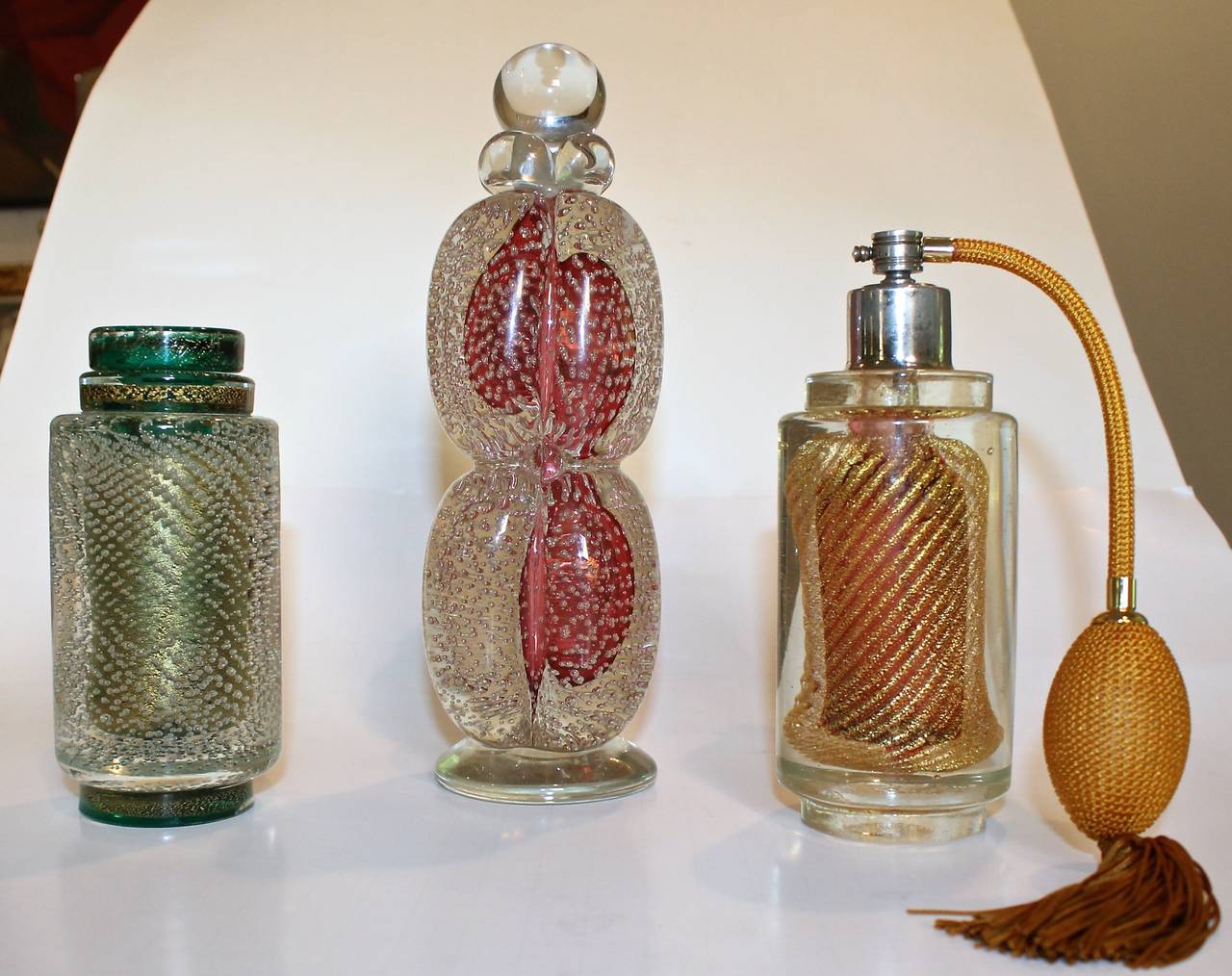 Beautiful trio (3) Murano Italian handblown perform bottles.
Sizes: Red bottle 9.25 T x 3