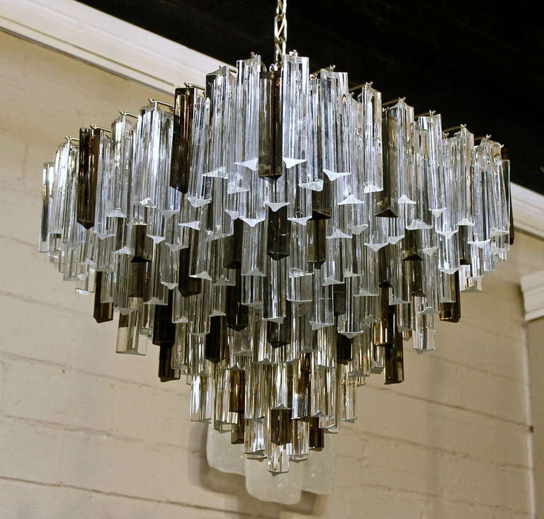 Exraordinary Venini square shaped multi-tier triedi crystal prism chandelier, with clear and smoke colored glass prisms. Chrome plated steel frame. Newly wired. Uses 8  