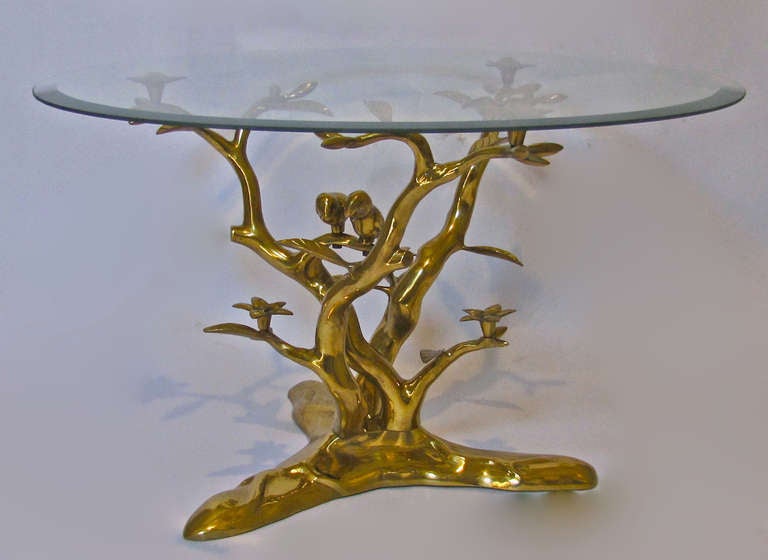 Organic tree form bronze cocktail accented with flowers and pair birds, attributed to Willy Daro. Table base can accommodate a circular, square or rectangular top. The table base is 18.5
