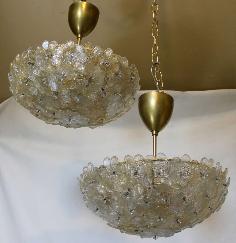 Pair of exquiste Barovier floral pendant ceiling lights with brass hardware and ceiling caps. Flowers alternate with clear glass and gold inclusions and clear glass only. Each takes two 60-watt max A bulb size, newly wired. Height/drop can be