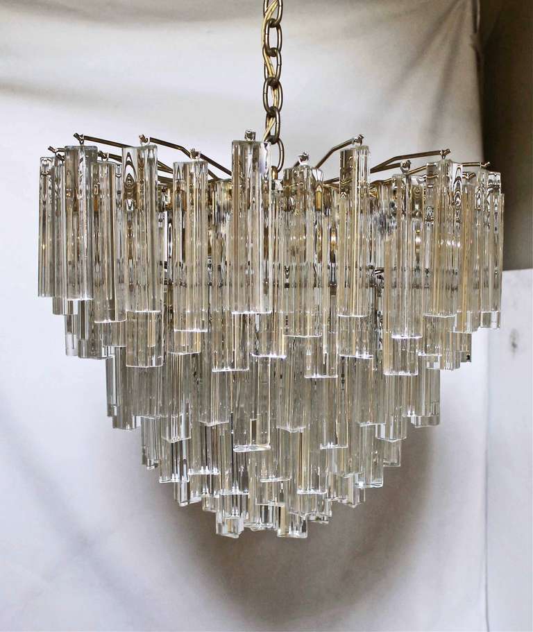 Venini multi-tier Triedi crystal prism chandelier with brass plated steel frame. Uses 4 - 60 watt max 