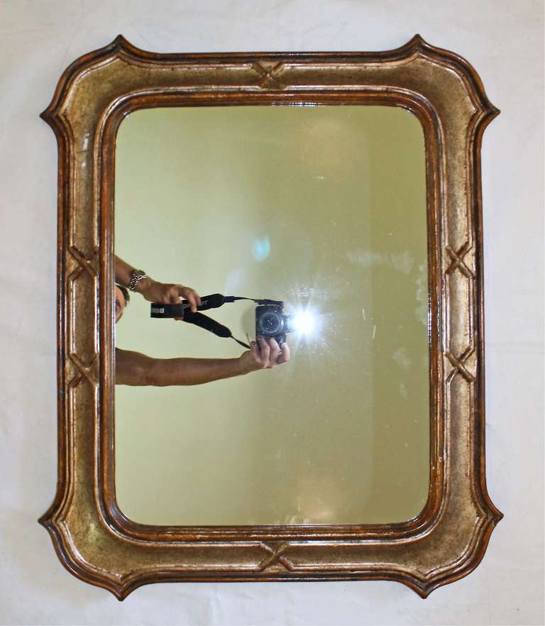 Vintage Italian silver gilt and painted/stained carved wood frame wall mirror. Clean and classic detailing with 