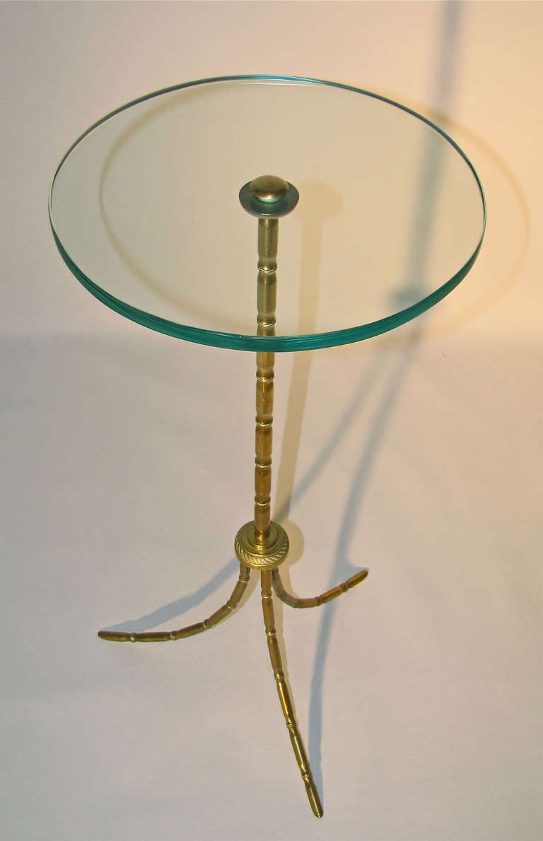 French Bagues inspired finely detailed bronze faux bamboo side table with round glass top.