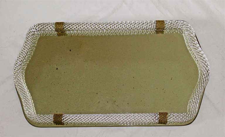 Large Murano mirrored glass vanity tray surmounted by thick twisted mouth blown glass with decorative brass straps. Glass rope is created from a single piece of clear twisted and fold glass.