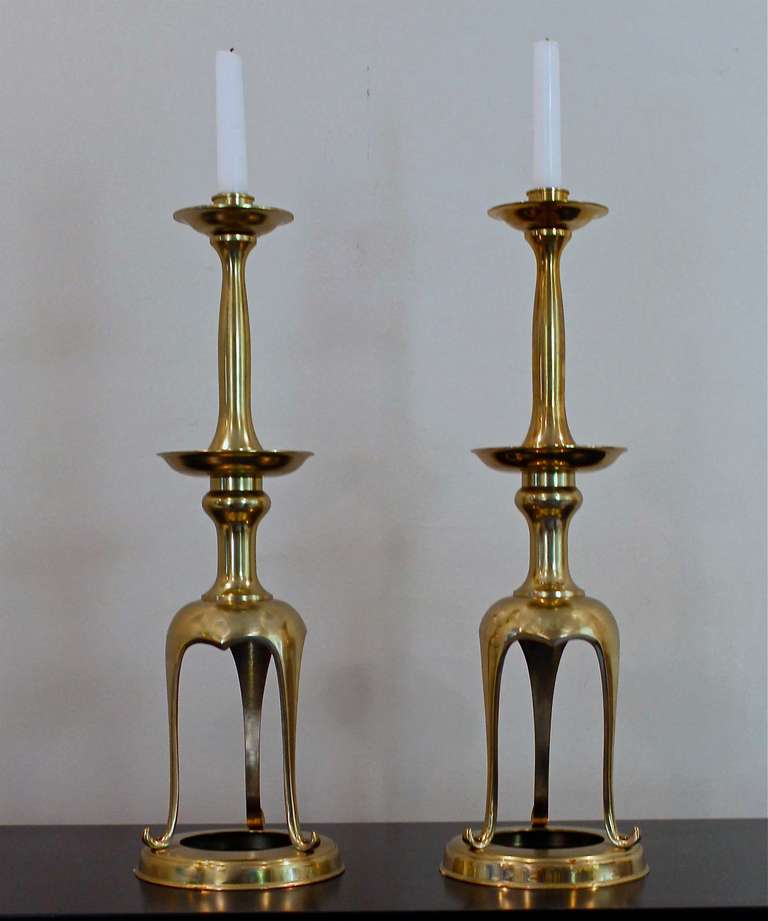 Pair of solid brass elegent shaped Japanese candlestick holders with double bobeche and open base form. Lacquered brass has aquired patina. 20