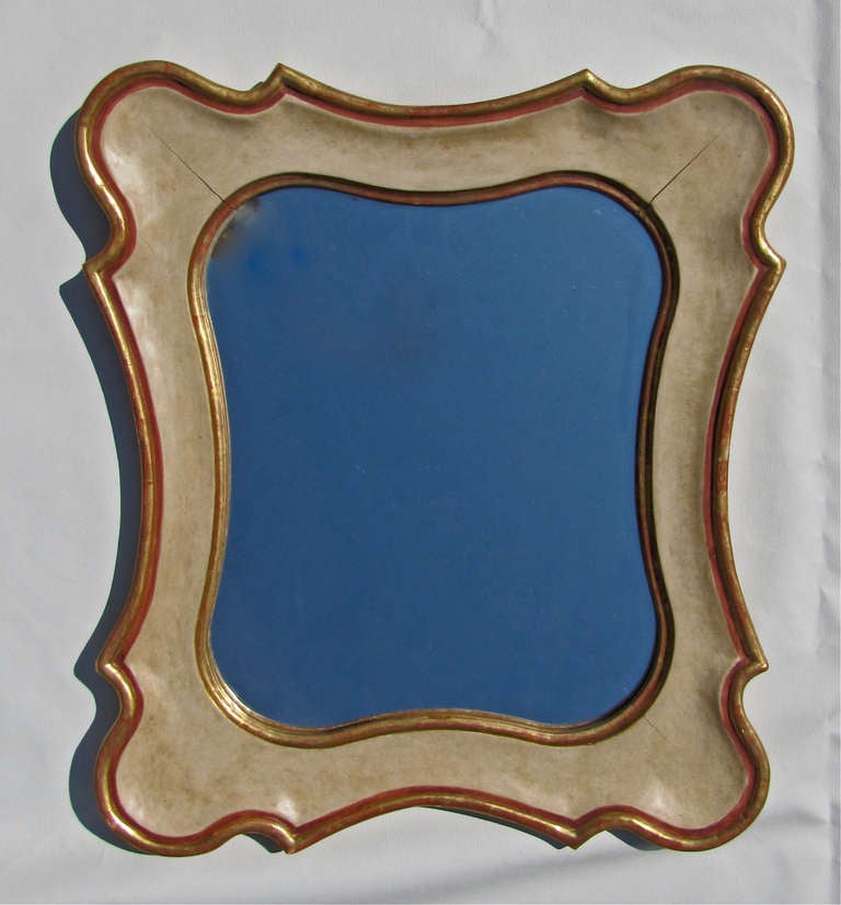 Attractive Italian partial gilt and painted wood wall mirror.