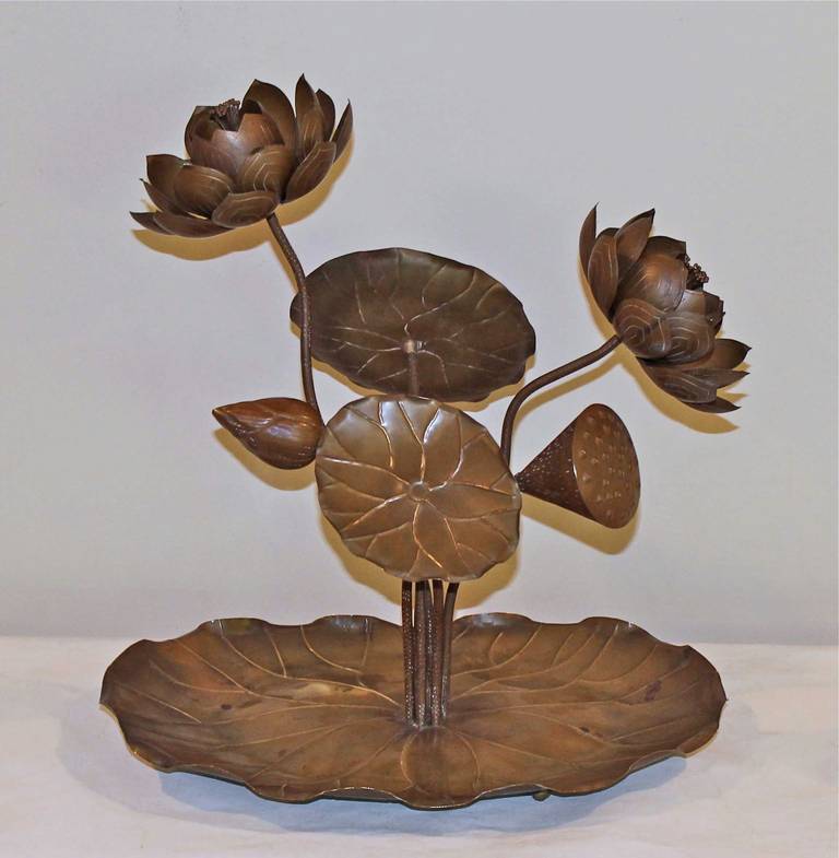 Rare lotus brass floral sculpture resting on a large lily pad tray with shell feet. Intricately designed with dark bronze patina, stamped "made in Hong Kong."

This item is located at our Dallas showroom.