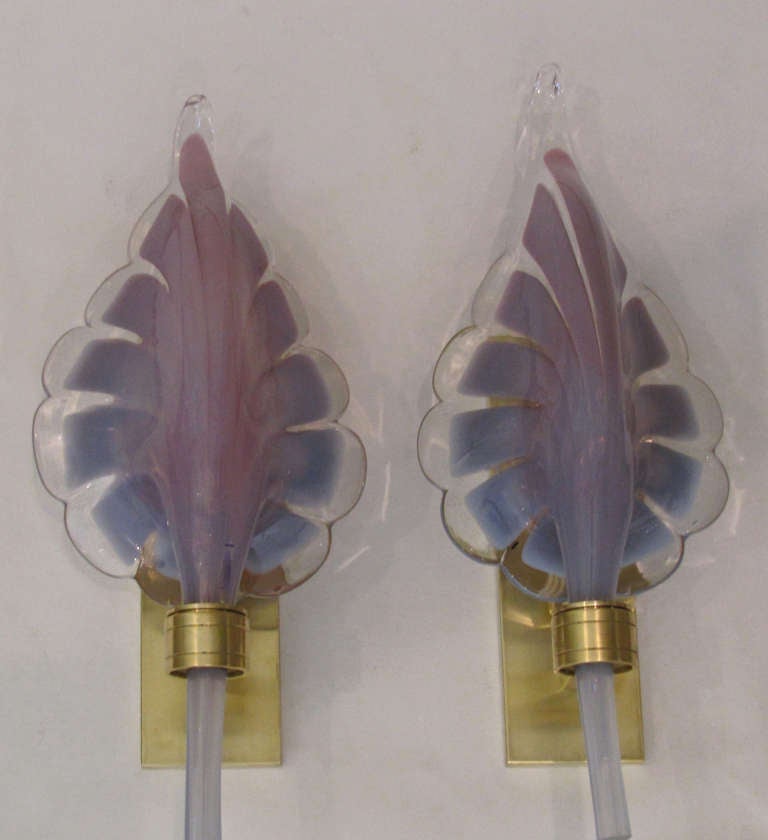 Pair of Italian Murano purple lavender hand blown glass leaf shaped wall sconces, mounted on brass backplates. Newly wired, takes one 40-watt candelabra size bulb. Second pair available - see separate 1stdibs listing.