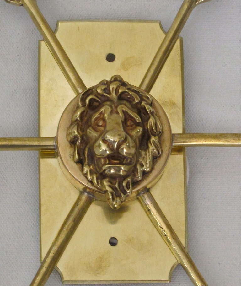 Pair French Brass Arrow Lion Head Brass Sconces at 1stDibs