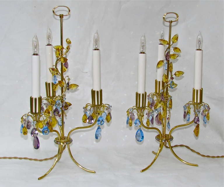 Early pair of Lobmeyr three-light table lamps exquisitely designed by Oswald Haerdtl for the World Exposition in Paris, 1937. Typical of Haerdtl's designs during this period, these small table lamps bear organic features. The simple brass frame is