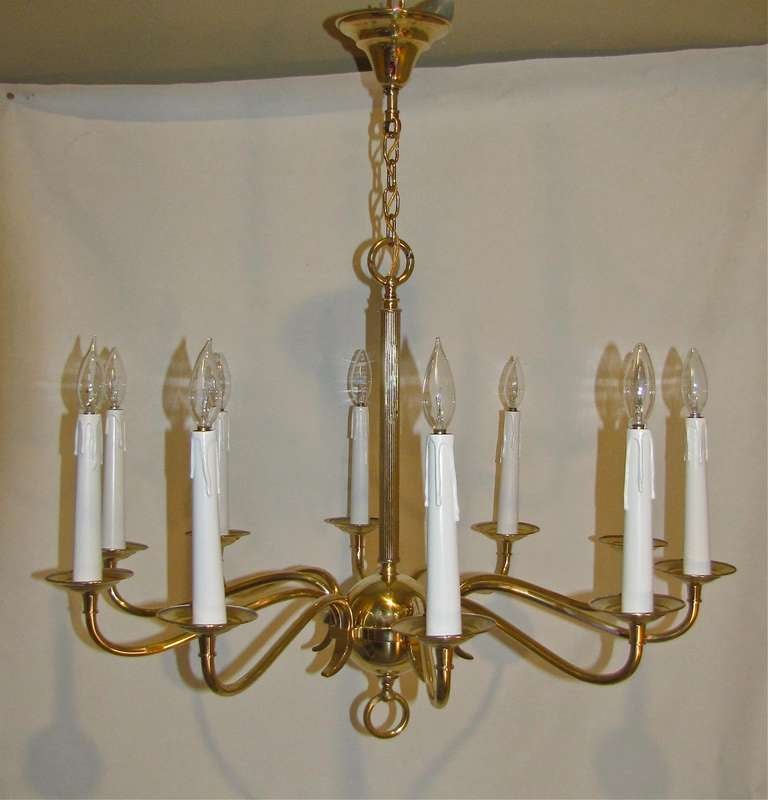 Exquisite French moderne 10 light brass chandelier. Rewired. Chandelier uses 10-40 watt max candelabra base bulbs.