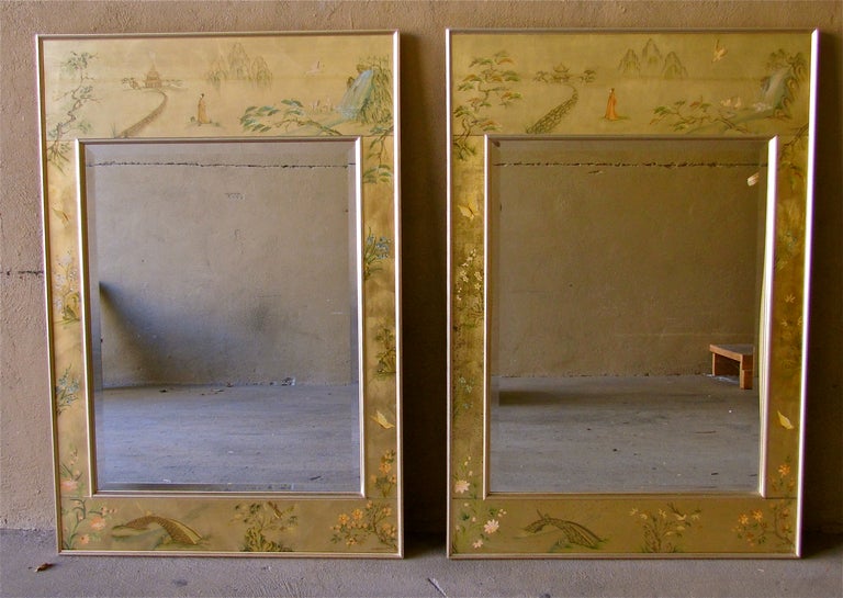 Pair of attractive egolmise reverse hand painted Asian inspired wall mirrors by LaBarge each signed.