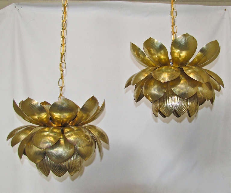 Pair of large brass lotus blossom light pendants or chandeliers. Each with one lower regular size bulb 75-watt light and 3 smaller 40-watt candelabra size lights on top, rewired. Lotus flower is 15