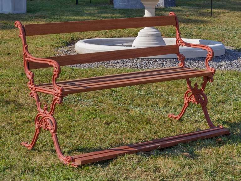 Refurbished bench with cast iron ends and newly replaced mahogany wood slats.  The inset picture shows the English diamond design patent registration stamp.  The original design was registered and patented on July 13,1857.  What makes this bench
