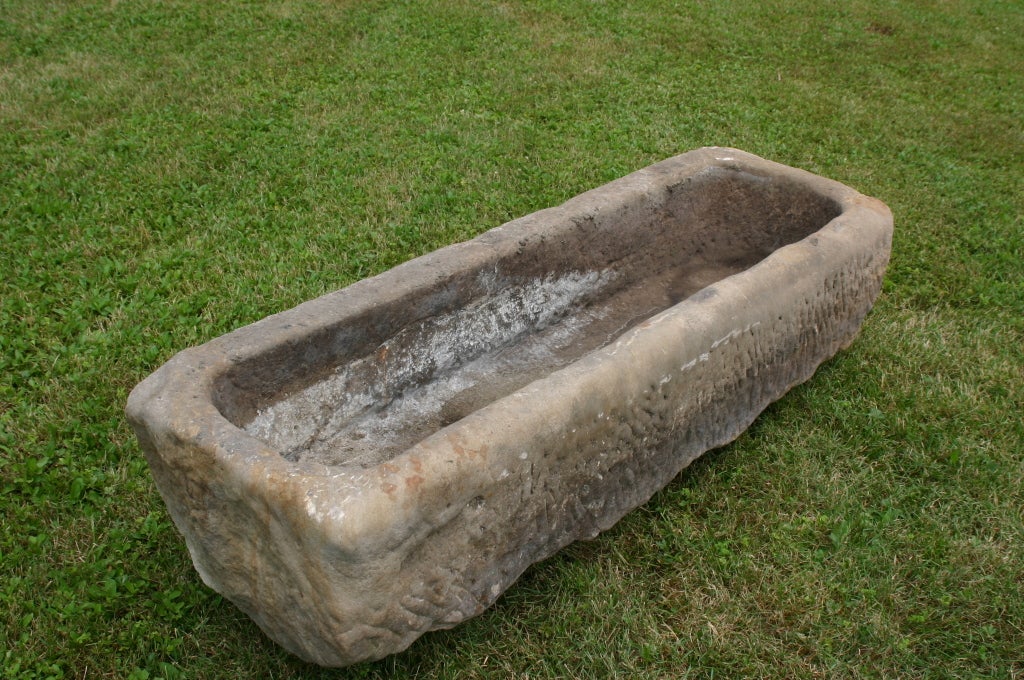 Carved stone trough with well worn edges which gives us the impression that this piece is over 150yrs old.  Can be a beautiful water feature or we could add drainage for planting
