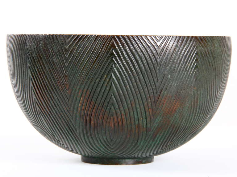 Axel Salto: A patinated bronze bowl,  with rifled geometrics  pattern in relief.