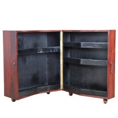 Scandinavian bar on wheels in rosewood.