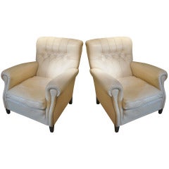 A Pair Of White Leather Armchairs.