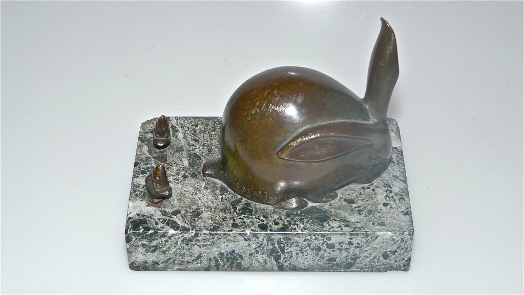 Very good figurine of a rabbit and two carrots in bronze on a green marble base.Original early piece signed Sandoz and
