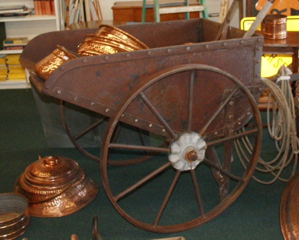 This is a Two Man ore cart from the Sierra Nevada Mountains in Northern Nevada. The iron cart was loaded with rock and ore deep beneath the ground in mines and pushed by two men to the surface of the earth where the gold and silver ore was separated