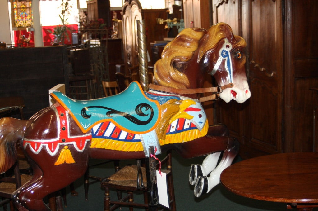 This is a circa 1915 Spillman Engineering original carousel horse. It was made by the Spillman Company for a carousel in New England. It has been repainted in traditional colors in 1985. It measures about 58