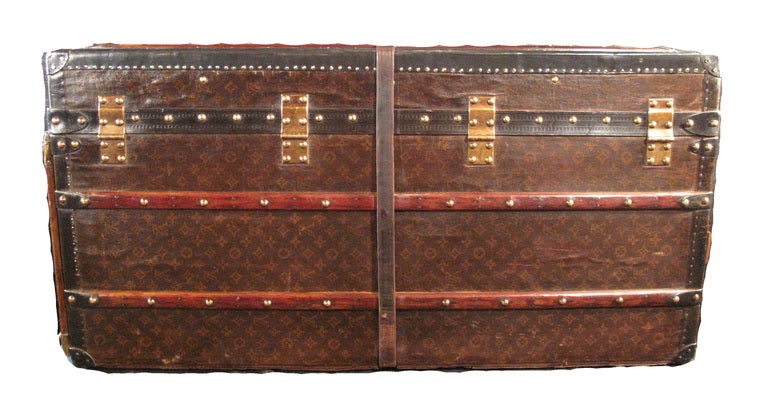 Louis Vuitton gentleman trunk in excellent vintage condition.  Exterior features signature LV monogram canvas trimmed with lozine and brass hardware.  This piece can be used as a trunk or armoire with casters and rollers located along one base side