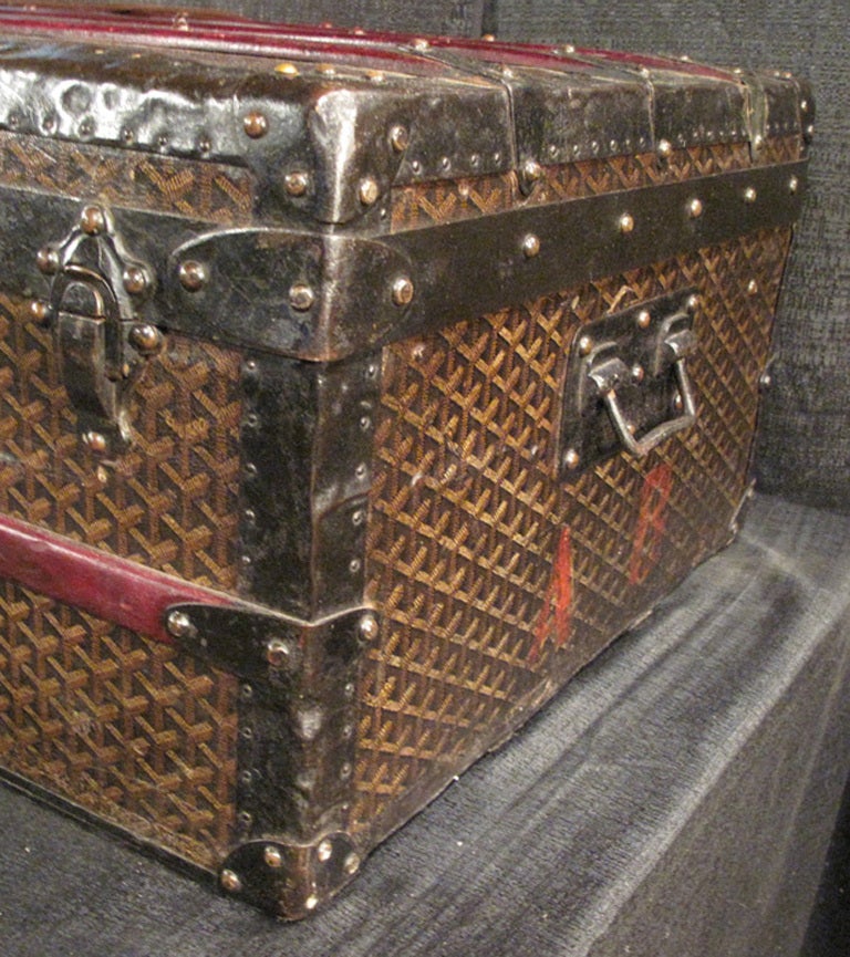 Stunning Goyard monogram canvas half trunk c1900 in excellent condition.  Signature monogram goyard canvas exterior trimmed with burgundy stained wood, metal, and brass hardware.  Interior is fully lined with beige canvas and does show signs of age.