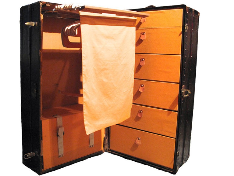 RARE Louis Vuitton Katherine Cornell Wardrobe c.1913 in excellent antique condition.  Louis Vuitton monogram canvas exterior trimmed with lozine, brass, and wood.  Interior fully lined in yellow canvas and features 6 drawers on one side and a