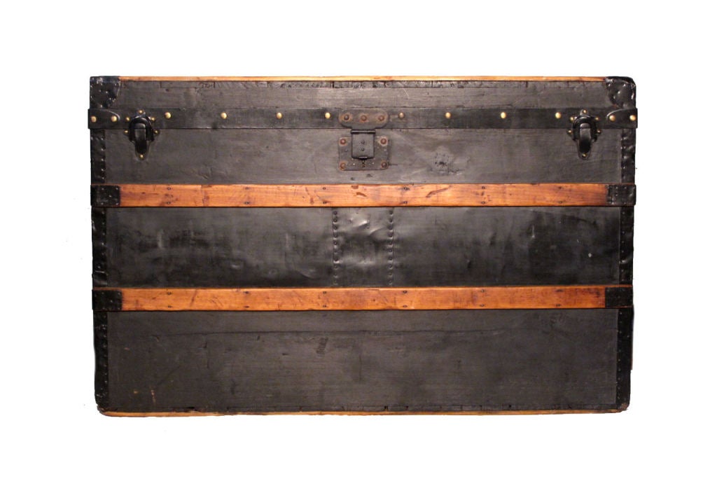 This rare and collectible Louis Vuitton Trianon Steamer trunk is in excellent condition.  The black wood exterior is perfectly accented with golden wood trim and in superb condition.  The interior is in excellent condition as it has been fully