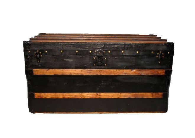 This rare and collectible Louis Vuitton Trianon Steamer trunk is in excellent condition.  The black wood exterior is perfectly accented with golden wood trim and in superb condition.  The original interior is in very good original condition and