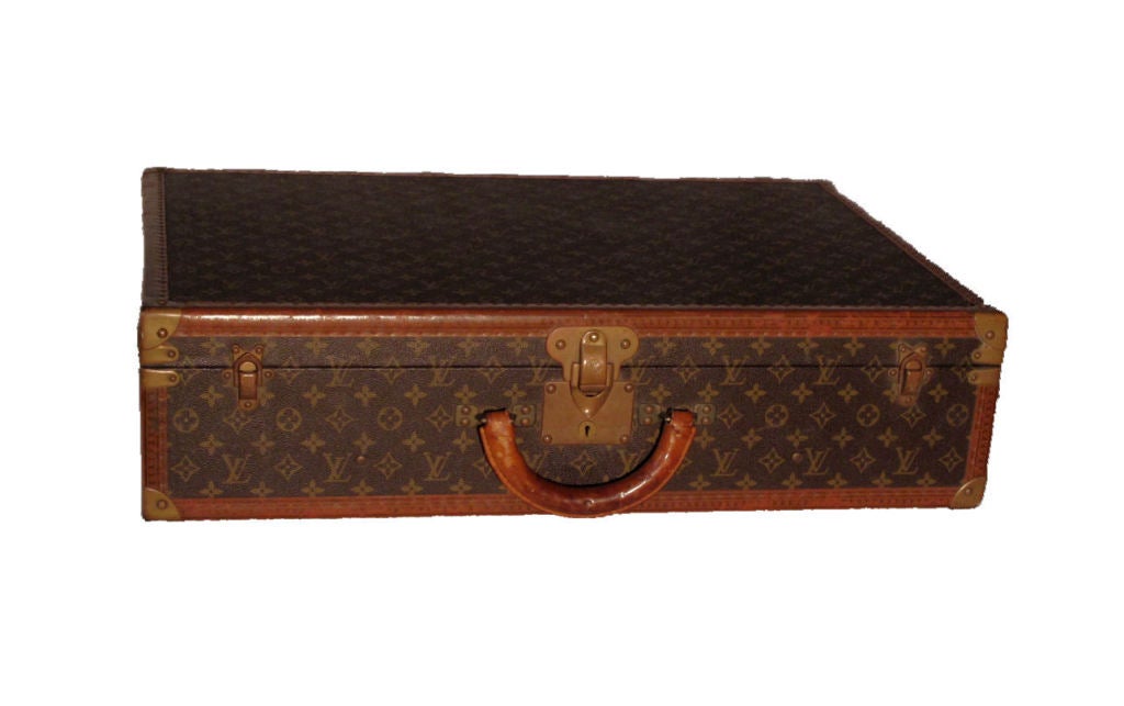 Louis Vuitton Bisten suitcase form the 1960s in excellent condition and rare size. Exterior features signature LV monogram canvas, lozine trim, and brass hardware with slight patina due to age. This piece has lots of character and cannot be found