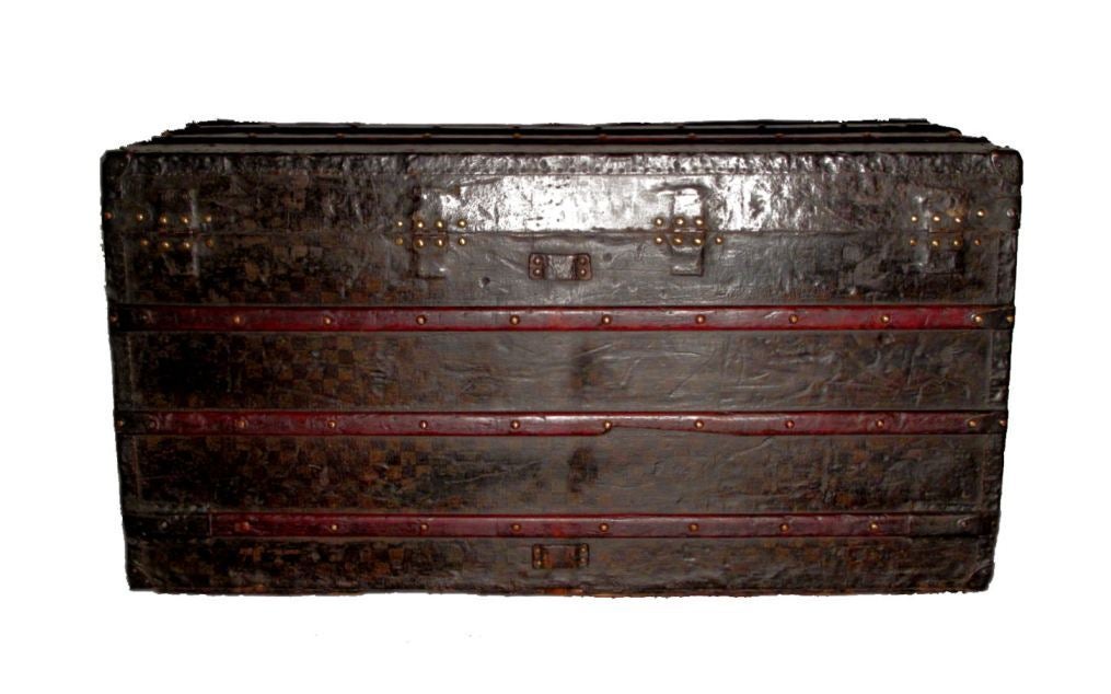 Louis Vuitton damiere gentlemans steamer trunk in very good vintage condition.  The exterior features signature LV checkered monogram pattern trimmed with metal, wood, and brass hardware.  The interior is in excellent condition.  
Measurements: