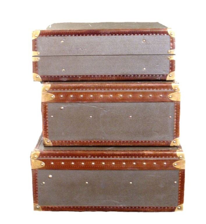 Louis Vuitton set of 3 constellation suitcases in excellent vintage condition.  Exterior features rare sharkskin leather trimmed with brown leather and brass hardware.  The interiors are in excellent condition and come complete with individual trays