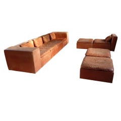 Beautifully faded leather french 1970s five seater sofa
