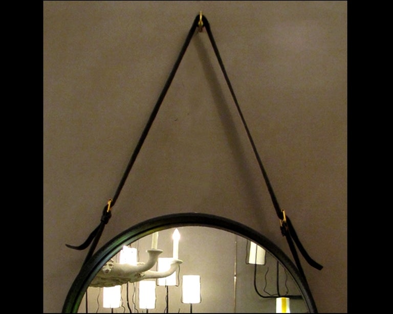 French Round mirror by Jacques Adnet